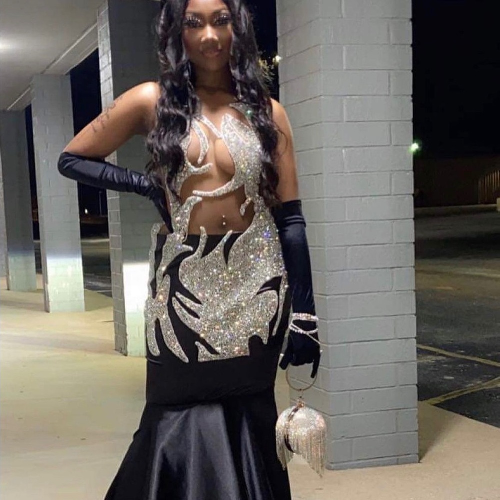 this is a hand made prom dress very sequenced and lace with lace glows in dark